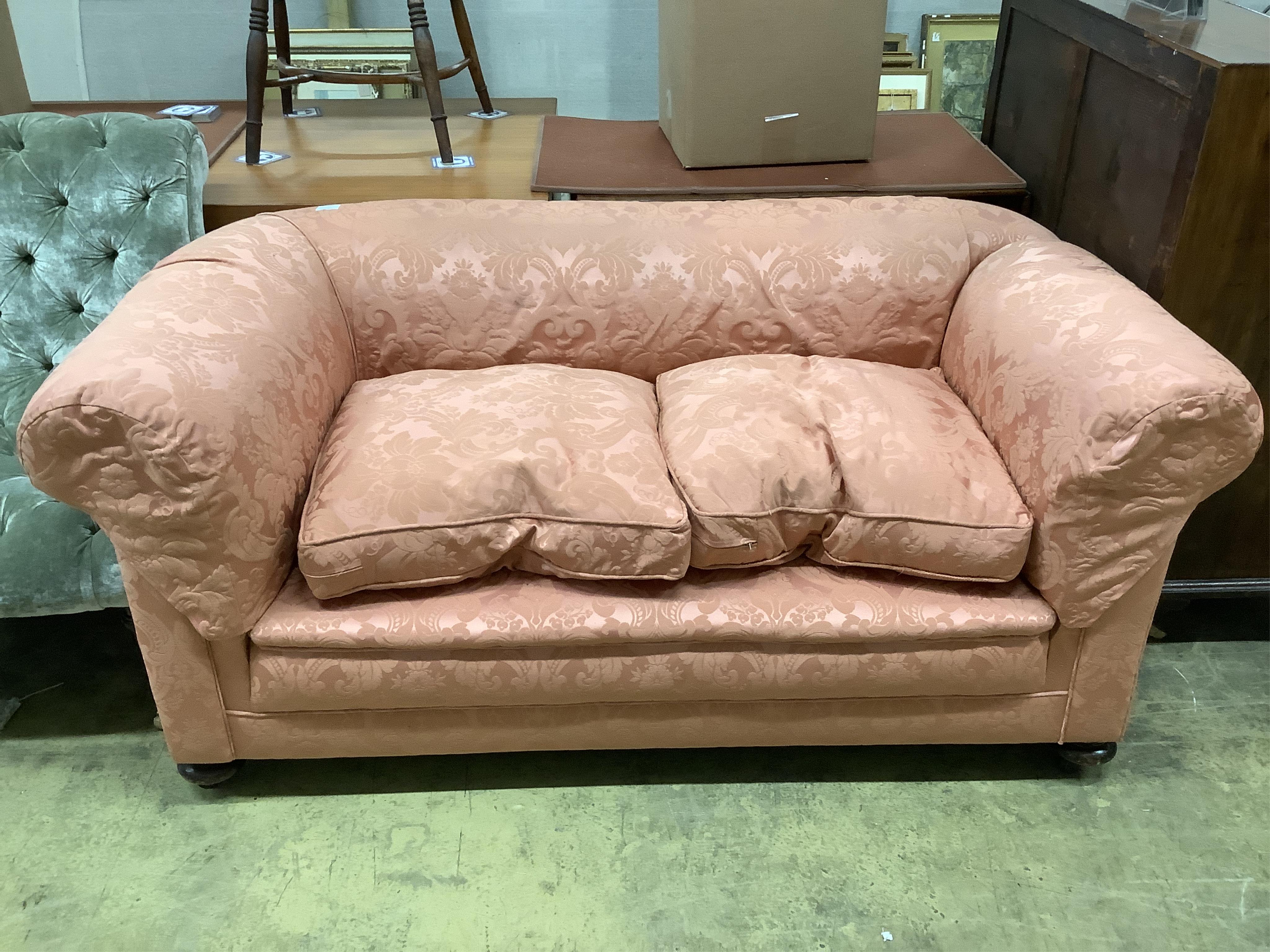 An early 20th century upholstered drop arm Chesterfield settee, width 166cm, depth 90cm, height 74cm. Condition - good